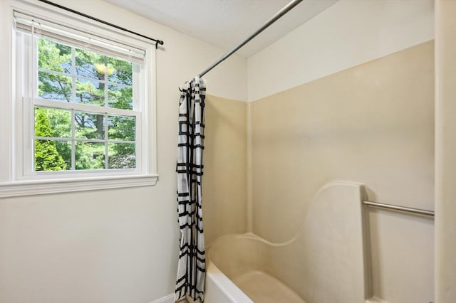 523 Washington St Unit A9, Pembroke, MA 02359 - bathroom featuring healthy amount of natural light and shower / bath combo with shower curtain