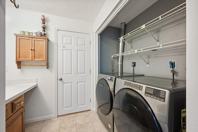 523 Washington St Unit A9, Pembroke, MA 02359 - laundry area with washer and dryer and light tile patterned floors