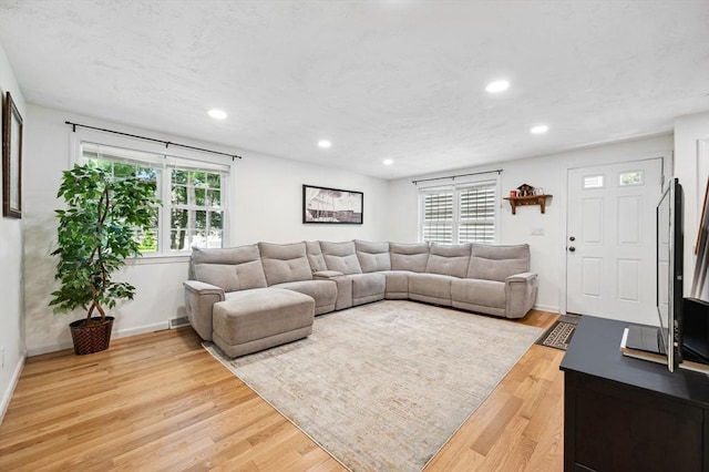 523 Washington St Unit A9, Pembroke, MA 02359 - living room with recessed lighting and light wood-style flooring