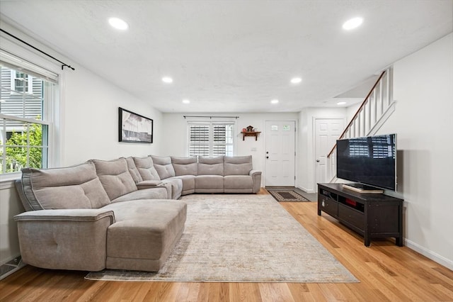 523 Washington St Unit A9, Pembroke, MA 02359 - living area featuring recessed lighting, light wood-style flooring, and stairway