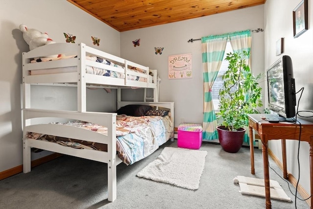 bedroom featuring wood ceiling and carpet flooring