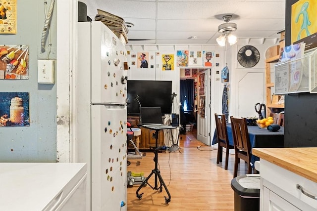 interior space featuring light wood-type flooring and ceiling fan