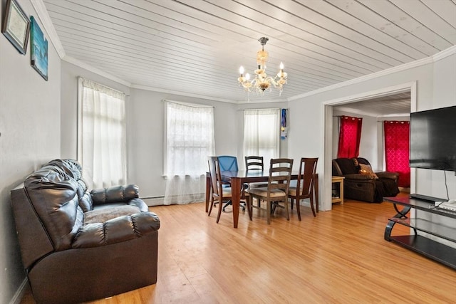 dining area featuring plenty of natural light, light wood-style flooring, an inviting chandelier, and ornamental molding