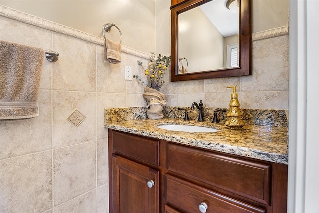 bathroom featuring vanity and decorative backsplash
