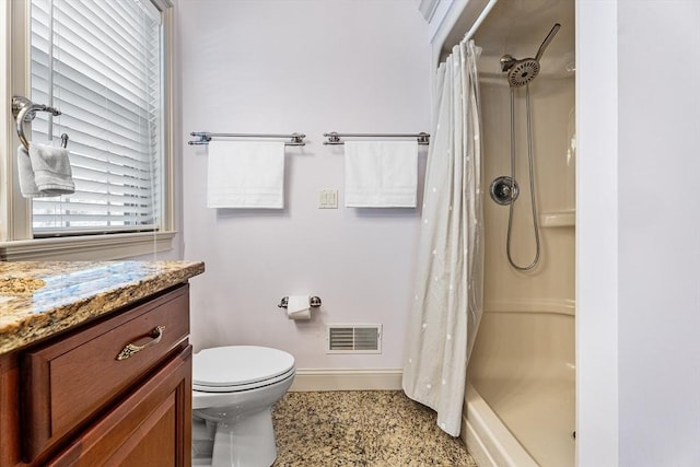 bathroom with baseboards, visible vents, a stall shower, and toilet