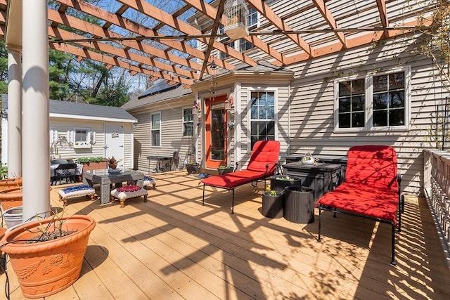 wooden terrace featuring a pergola and outdoor lounge area