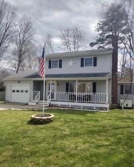 211 Hancock Rd, Pittsfield, MA 01201 - traditional-style home with covered porch, a garage, a chimney, and a front yard
