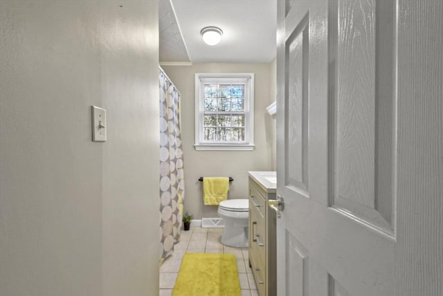 bathroom featuring visible vents, toilet, a shower with curtain, tile patterned floors, and vanity