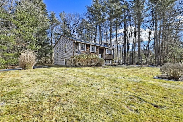 view of front of home featuring a front yard and a chimney