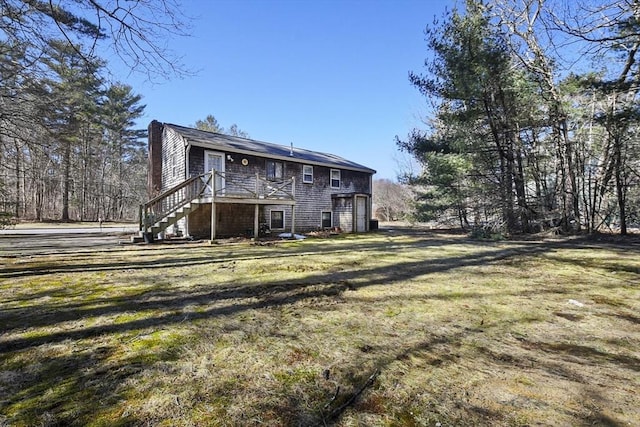 back of property featuring stairs