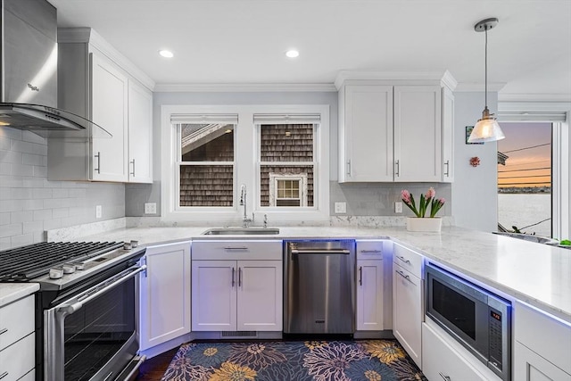 131 Dorchester St Unit 131, Quincy, MA 02171 - kitchen with stainless steel appliances, wall chimney range hood, a sink, backsplash, and crown molding