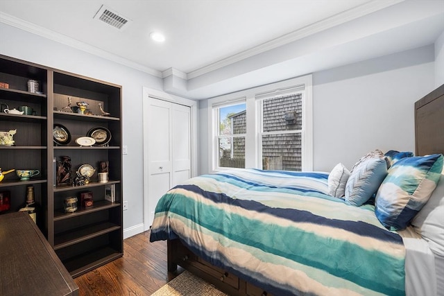 131 Dorchester St Unit 131, Quincy, MA 02171 - bedroom with crown molding, dark wood-style floors, baseboards, and a closet