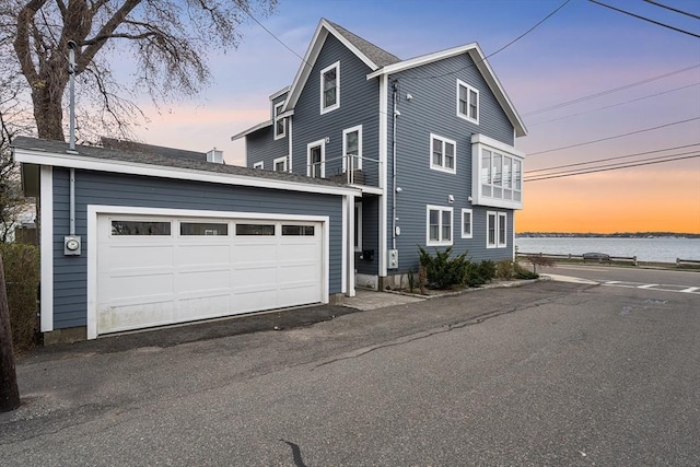 131 Dorchester St Unit 131, Quincy, MA 02171 - property exterior at dusk featuring a garage and an outbuilding