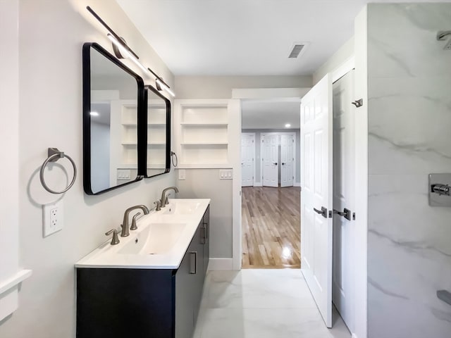 bathroom featuring vanity and wood-type flooring