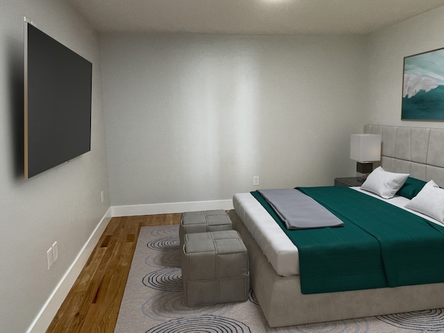 bedroom with hardwood / wood-style flooring