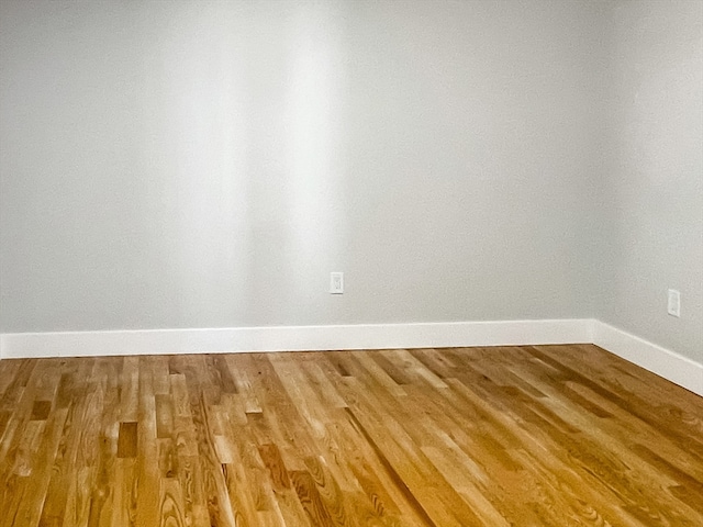 unfurnished room featuring wood-type flooring