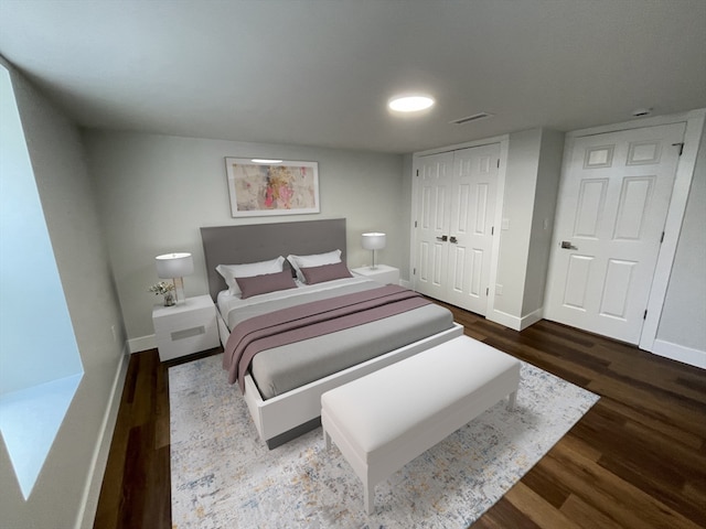 bedroom with hardwood / wood-style flooring and a closet