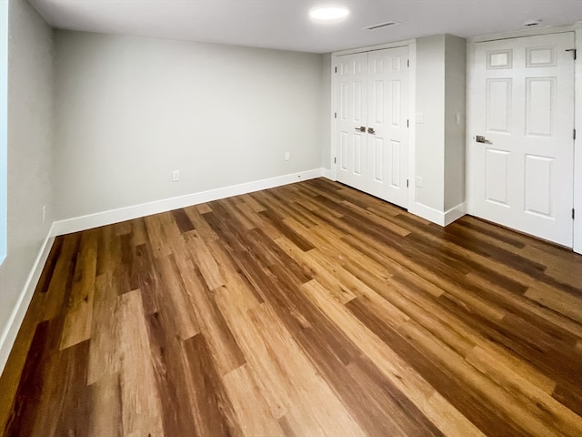 unfurnished bedroom featuring hardwood / wood-style floors