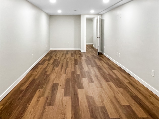 basement featuring dark hardwood / wood-style flooring