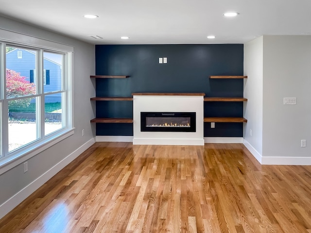 unfurnished living room with light hardwood / wood-style floors