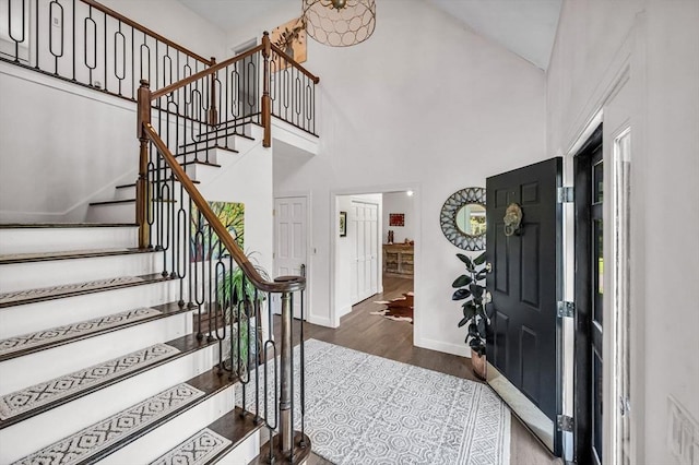 1 Webster Ln, Wilbraham, MA 01095 - entryway featuring wood finished floors, stairway, baseboards, and high vaulted ceiling