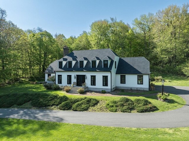 1 Webster Ln, Wilbraham, MA 01095 - cape cod-style house featuring a chimney, a front yard, and a wooded view