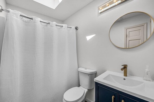 1 Webster Ln, Wilbraham, MA 01095 - full bath featuring toilet, vanity, a skylight, and curtained shower