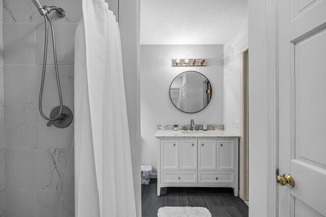 1 Webster Ln, Wilbraham, MA 01095 - full bathroom with vanity, a shower with shower curtain, wood finished floors, and a textured ceiling
