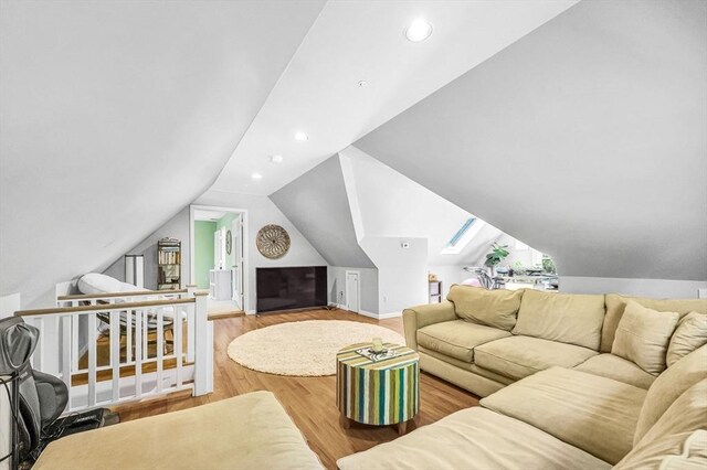 1 Webster Ln, Wilbraham, MA 01095 - living area featuring wood finished floors, recessed lighting, vaulted ceiling, and baseboards