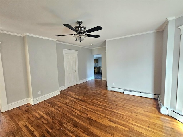 empty room featuring crown molding, wood finished floors, baseboards, and ceiling fan