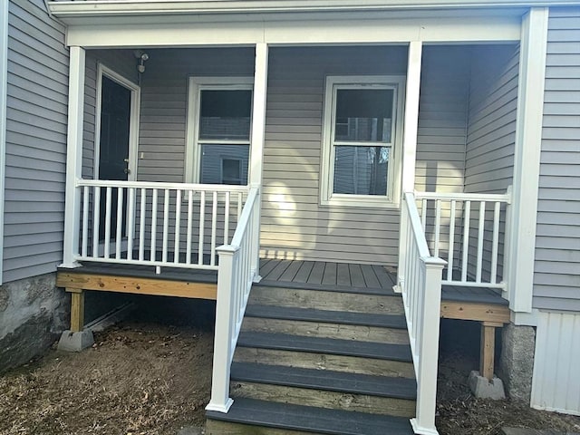 doorway to property featuring a porch