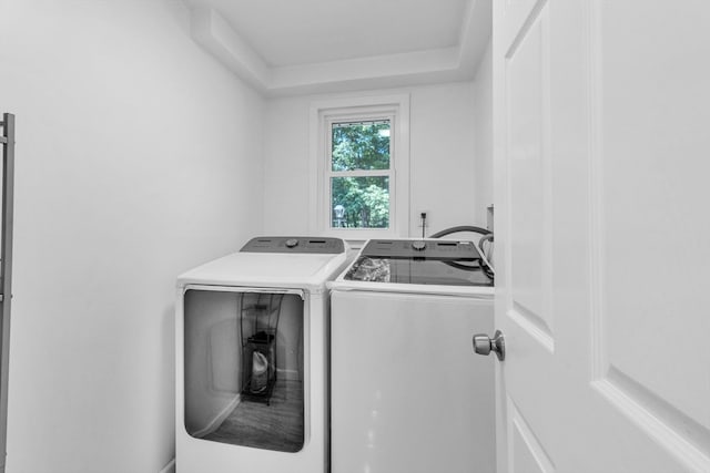 washroom with washing machine and clothes dryer