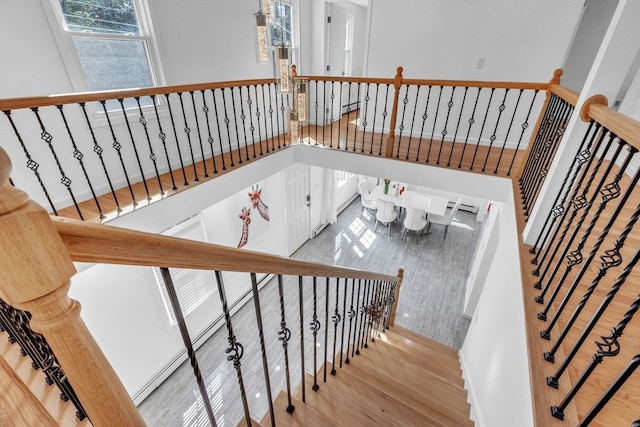 staircase featuring wood-type flooring