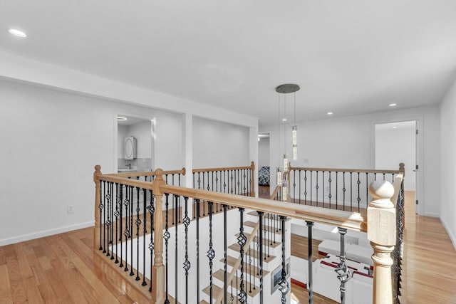 hallway with light hardwood / wood-style flooring