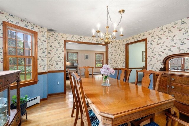 23 Lafayette Dr, Walpole, MA 02032 - dining area featuring wallpapered walls, baseboard heating, light wood finished floors, a chandelier, and healthy amount of natural light