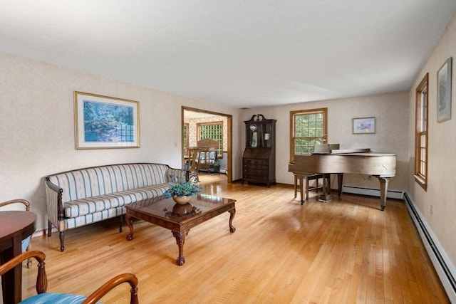 23 Lafayette Dr, Walpole, MA 02032 - living area with light wood-style flooring and a baseboard radiator