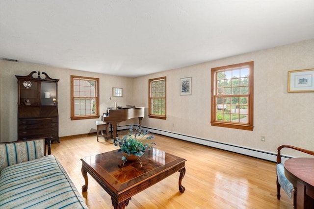23 Lafayette Dr, Walpole, MA 02032 - living area featuring wood finished floors and a baseboard heating unit