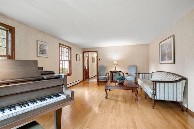 23 Lafayette Dr, Walpole, MA 02032 - living area featuring plenty of natural light, light wood finished floors, and baseboard heating