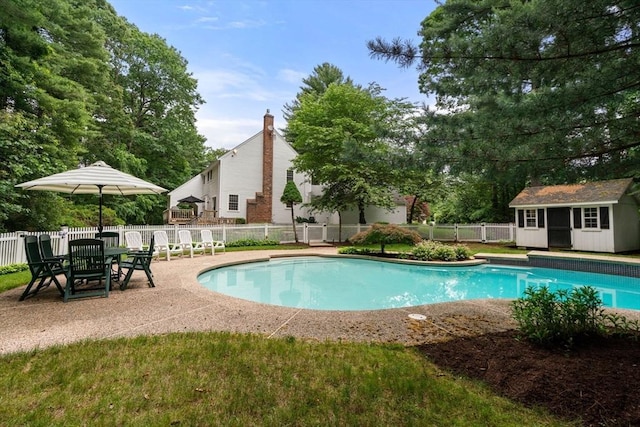23 Lafayette Dr, Walpole, MA 02032 - view of swimming pool featuring an outdoor structure, a fenced backyard, and a patio