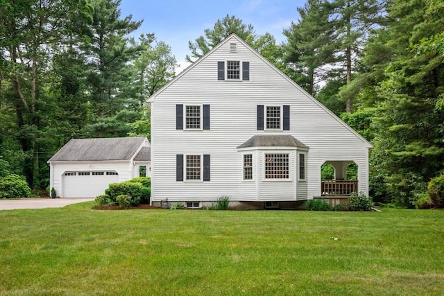 23 Lafayette Dr, Walpole, MA 02032 - view of front of home featuring an outbuilding, a front yard, driveway, and a garage
