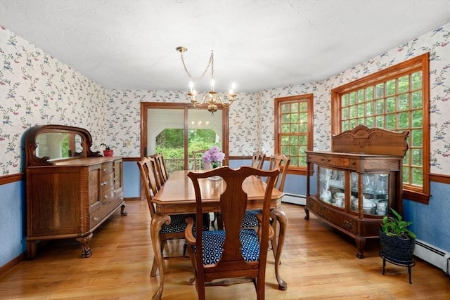 23 Lafayette Dr, Walpole, MA 02032 - dining room featuring wallpapered walls, a chandelier, light wood finished floors, and a baseboard heating unit