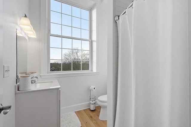 bathroom with a shower with shower curtain, vanity, toilet, and wood-type flooring