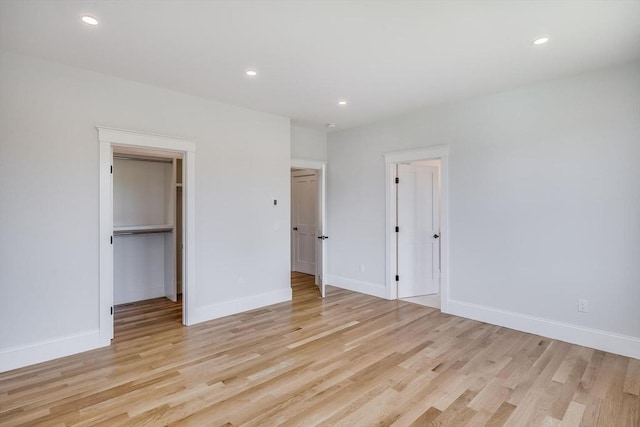 92 Whiffletree Ave, Brewster, MA 02631 - unfurnished bedroom featuring light wood-style flooring, recessed lighting, baseboards, and a spacious closet