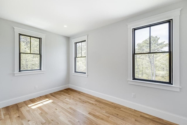 92 Whiffletree Ave, Brewster, MA 02631 - empty room with plenty of natural light, baseboards, light wood-style flooring, and recessed lighting