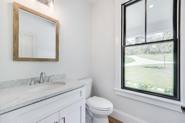 92 Whiffletree Ave, Brewster, MA 02631 - half bathroom with toilet, vanity, and baseboards