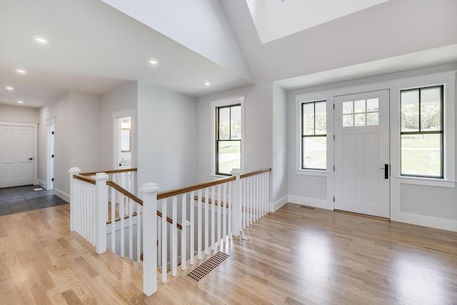 92 Whiffletree Ave, Brewster, MA 02631 - foyer entrance with light wood-style flooring, baseboards, recessed lighting, a skylight, and vaulted ceiling