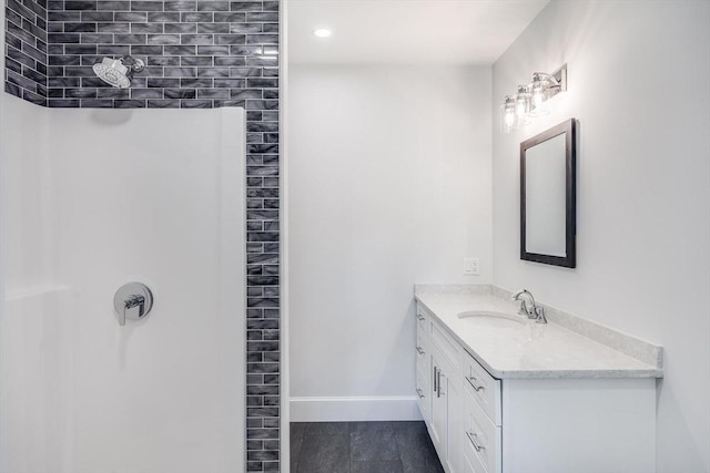 92 Whiffletree Ave, Brewster, MA 02631 - bathroom with a shower, vanity, baseboards, and tile patterned floors