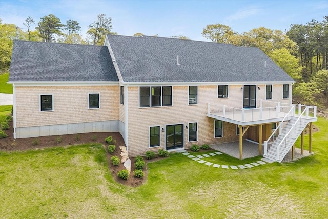 92 Whiffletree Ave, Brewster, MA 02631 - rear view of house featuring a lawn, a patio area, a deck, and a shingled roof