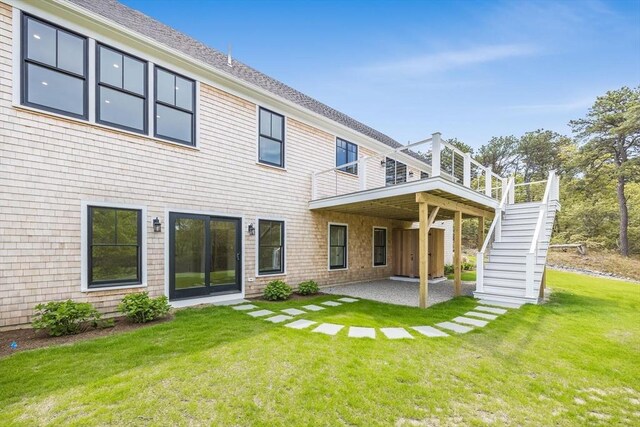 92 Whiffletree Ave, Brewster, MA 02631 - back of property with stairway, a patio, a lawn, and a deck