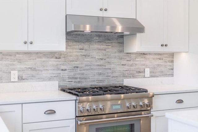 92 Whiffletree Ave, Brewster, MA 02631 - kitchen featuring stainless steel stove, under cabinet range hood, white cabinets, light countertops, and backsplash